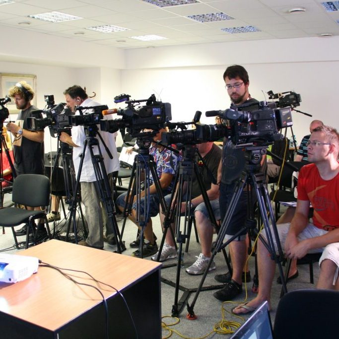 Cameras set up at a press conference