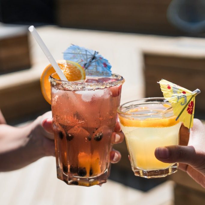 Women holding cocktails